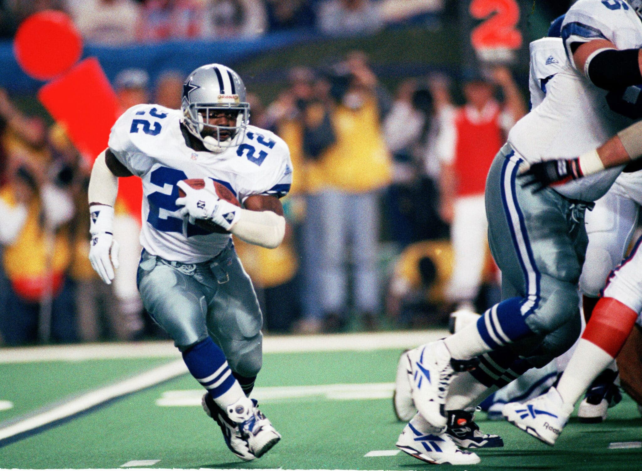 FILE - In this Sunday, Jan. 30, 1994 file photo, Dallas Cowboys running back Emmitt Smith (22) runs for short yardage against the Buffalo Bills during Super Bowl XXVIII action at the Georgia Dome in Atlanta. Smith rushed for 132 yards as Dallas defeated Buffalo, 30-12. (AP Photo/Susan Ragan, File)