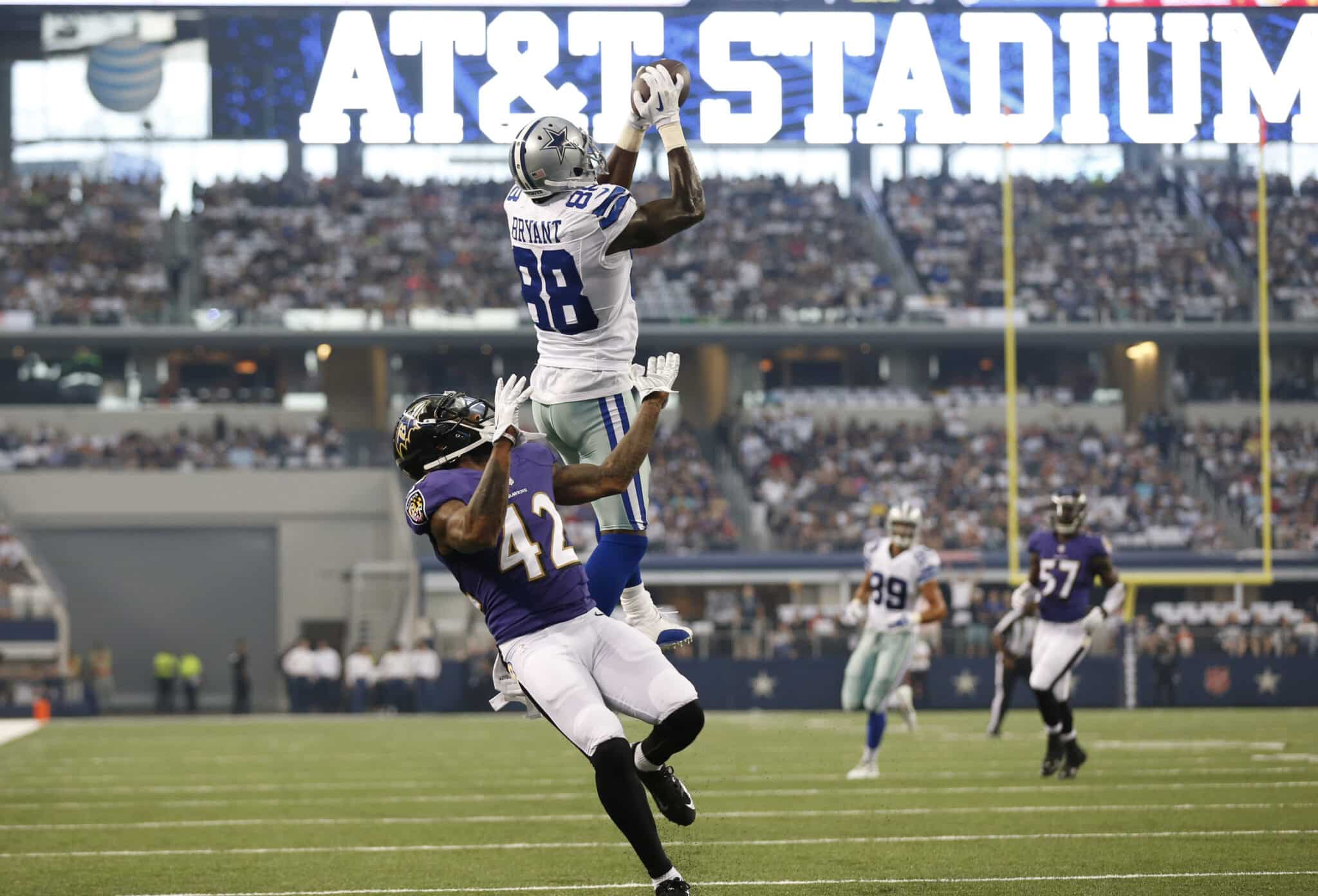 Aug 16, 2014; Arlington, TX, USA; Dallas Cowboys receiver Dez Bryant (88) catches a touchdown pass in the first quarter against Baltimore Ravens cornerback Dominque Franks (42) at AT&T Stadium. Mandatory Credit: Matthew Emmons-USA TODAY Sports