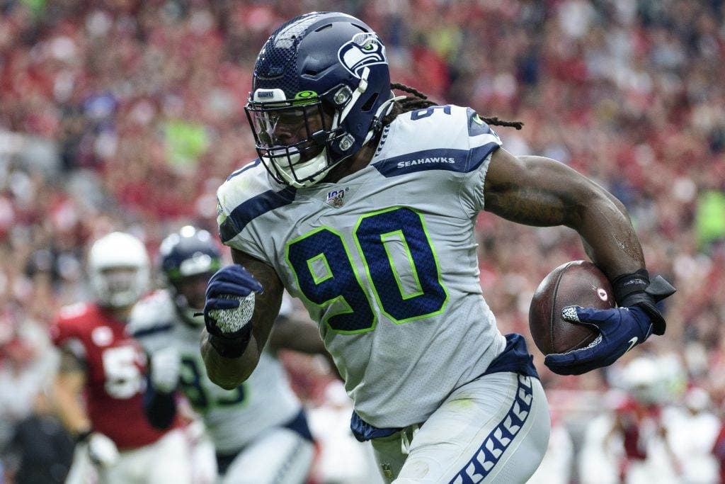 GLENDALE, ARIZONA - SEPTEMBER 29: Outside linebacker Jadeveon Clowney #90 of the Seattle Seahawks run in an interception for a touchdown in the first half of the NFL game against the Arizona Cardinals at State Farm Stadium on September 29, 2019 in Glendale, Arizona. (Photo by Jennifer Stewart/Getty Images) He will help out the rookie Cowboys on defense.