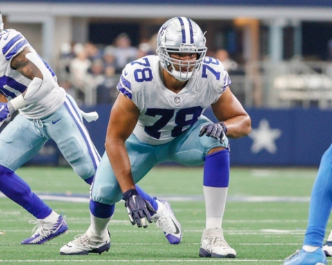 Cowboys' football player Terence Steele, in his number 78 jersey, crouches gracefully on the field, prepared to execute the second-round tender play.