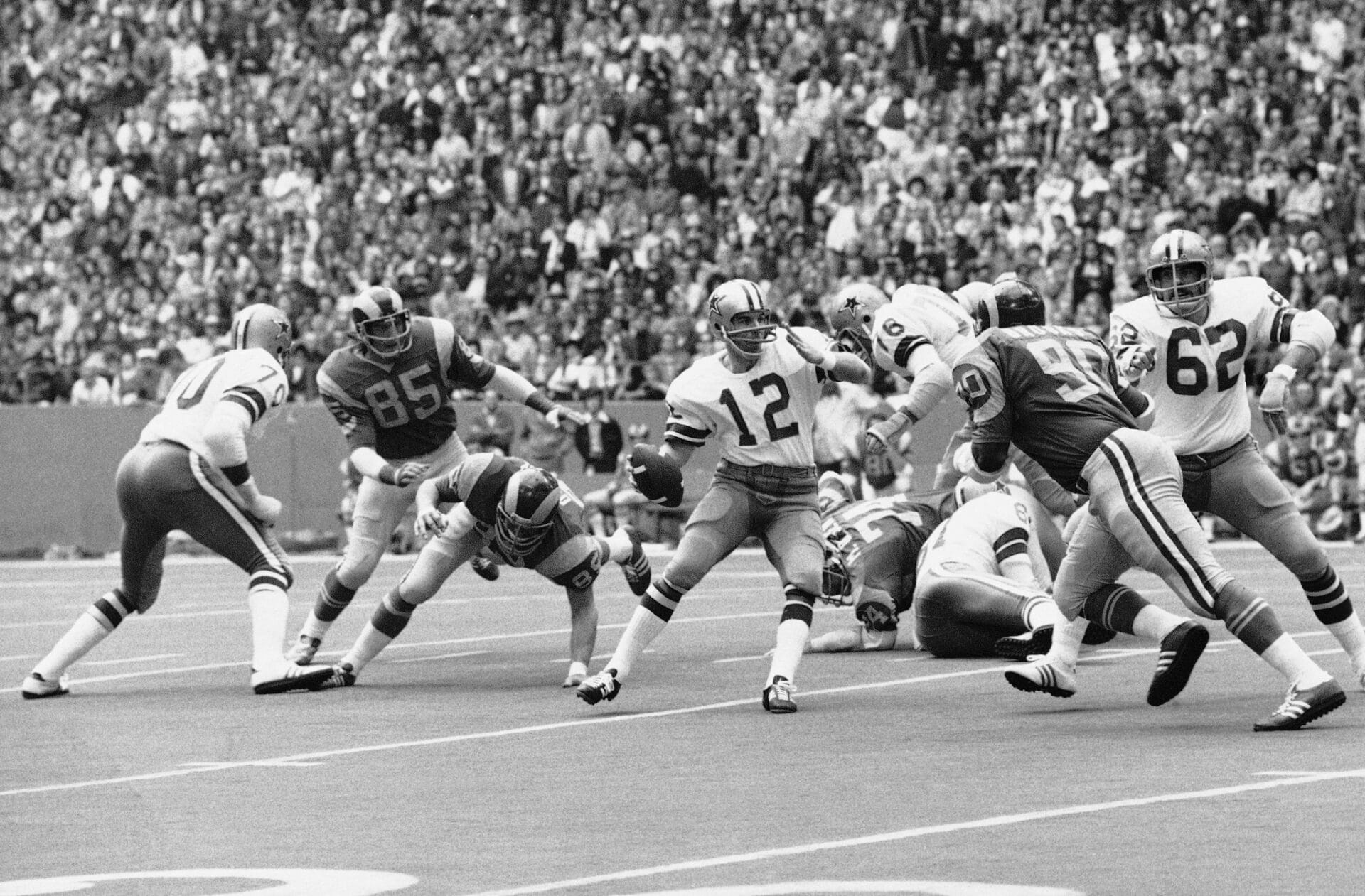 Roger Staubach looks to pass during the 1973 NFL Divisional playoff game at Texas Stadium against the Los Angeles Rams.