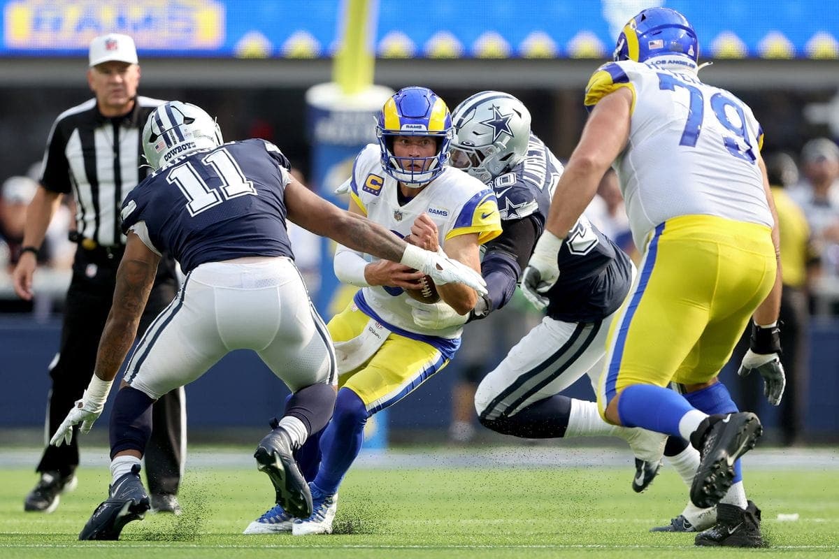 Rams QB Matthew Stafford under pressure by the Cowboys defense in a game on 10/9/2022.