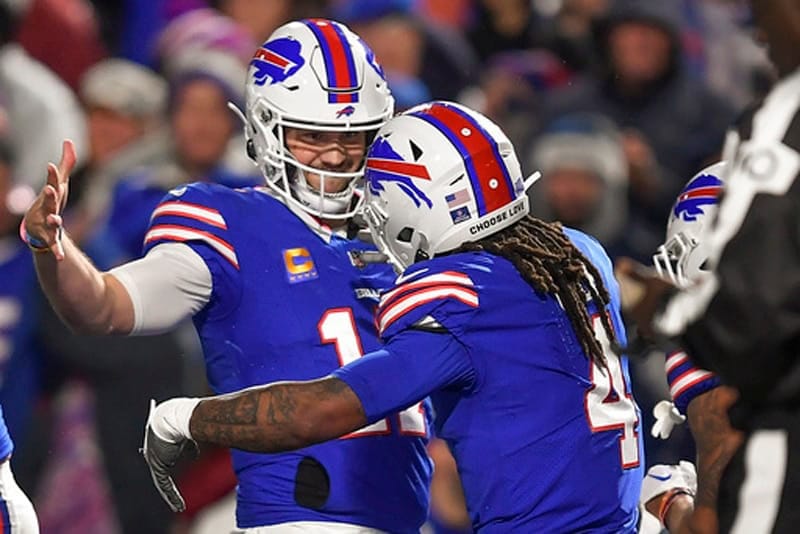 Buffalo Bills running back James Cook (4) celebrates with quarterback Josh Allen (17) after scoring touchdown against the Dallas Cowboys during the second quarter of an NFL football game, Sunday, Dec. 17, 2023, in Orchard Park, N.Y. (AP Photo/Adrian Kraus)