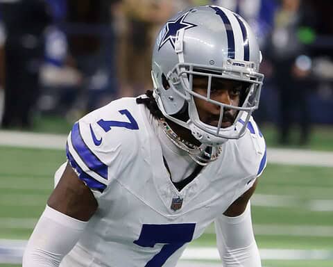 Football player in Dallas Cowboys uniform with number 7 on the field.