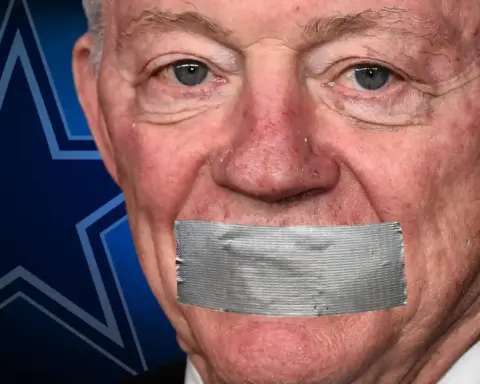 Older man with duct tape over his mouth in front of a blue background with a star pattern.