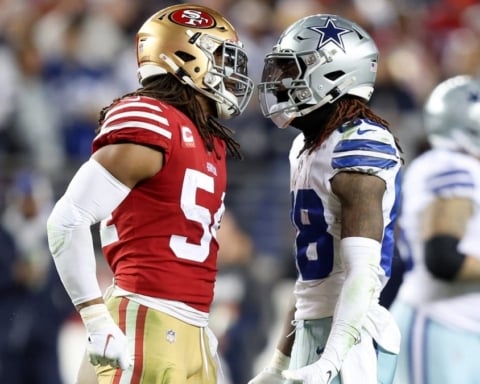 During Week 8, two American football players from opposing teams face off with the intensity of Cowboys vs. 49ers on the field.