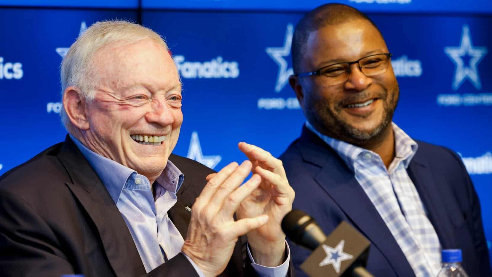 Cheerful Dallas Cowboys executives at a press conference or event, smiling and engaging with the audience, showcasing leadership and team spirit in the NFL sports industry.