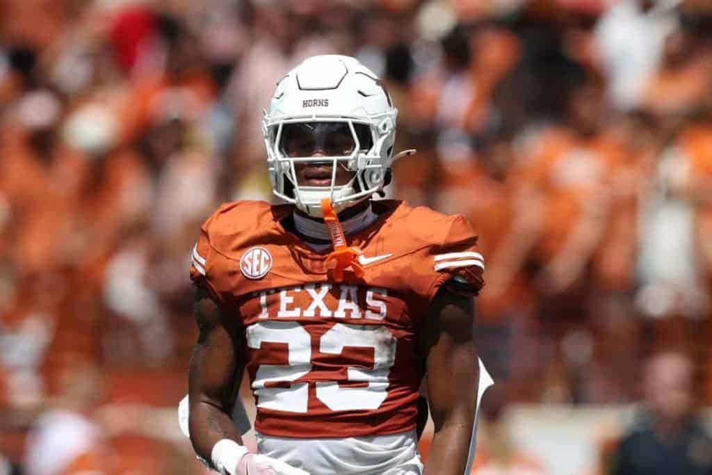 Amarillo Texas Longhorns football player wearing helmet and uniform during game.