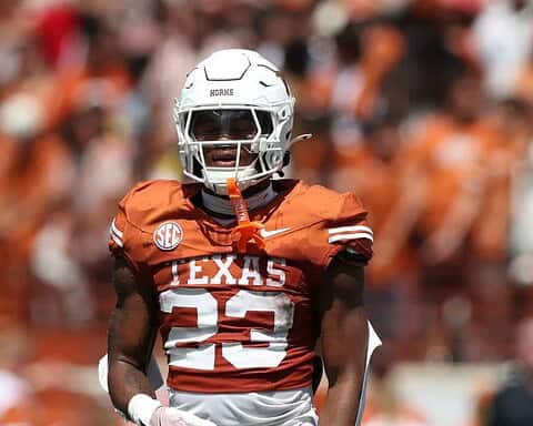 Amarillo Texas Longhorns football player wearing helmet and uniform during game.