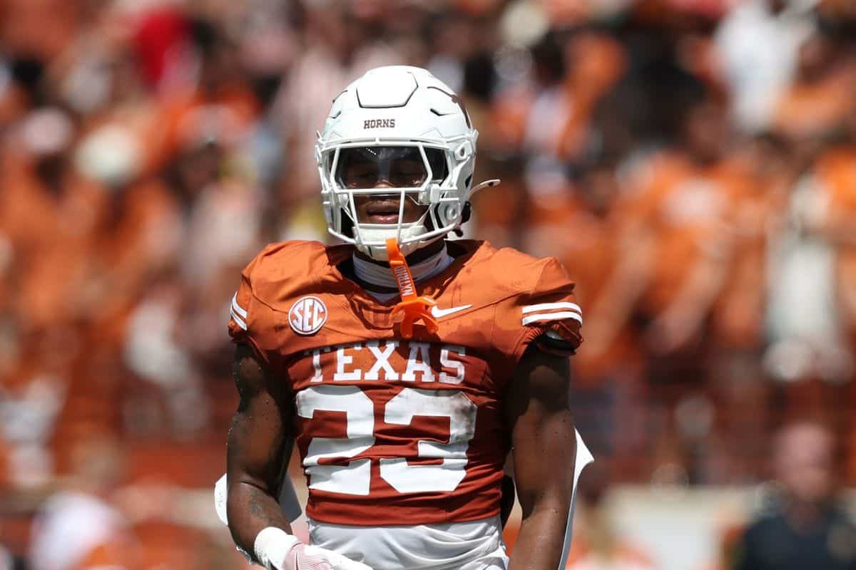 Amarillo Texas Longhorns football player wearing helmet and uniform during game.