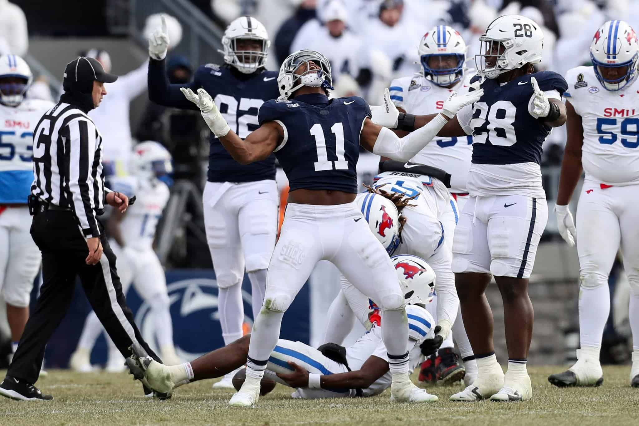 Throwing a touchdown pass during an intense college football game, showcasing team spirit and athletic performance on the field with players in inside the star uniforms.
