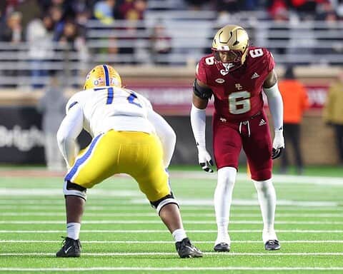 Lions defensive player facing off against a Texas Tech player during a college football game on the field.