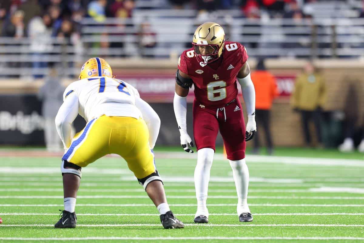 Lions defensive player facing off against a Texas Tech player during a college football game on the field.