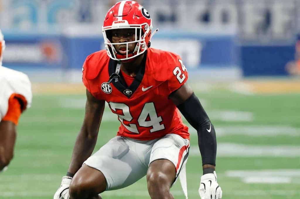 Young football player in red Georgia Bulldogs uniform ready for action during a game at inside the star stadium.