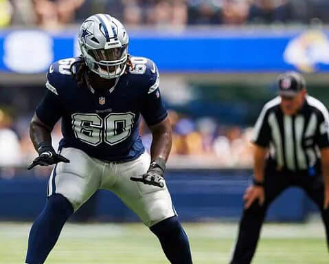 Dallas Cowboys linebacker in action during a game at AT&T Stadium, showcasing team defense and key plays.