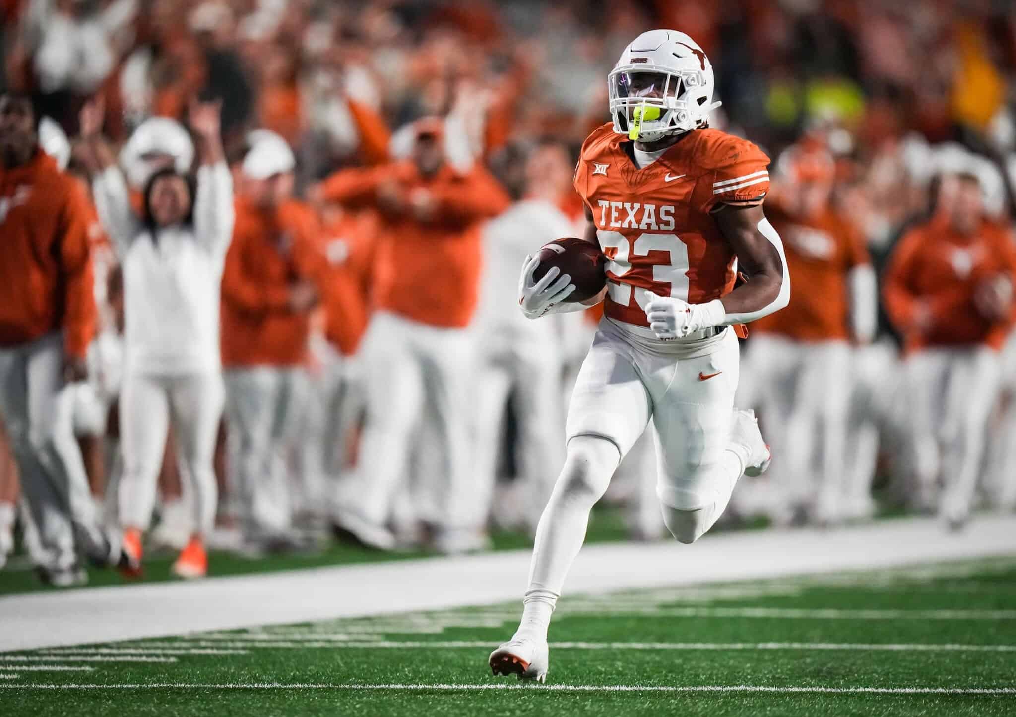 High school football player in Texas uniform running with football during game, showcasing athleticism, team spirit, and competitive sports action.
