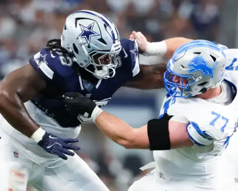 Dallas Cowboys linebacker engaging with Detroit Lions offensive lineman in a tackle during an NFL game. Intense moment showcasing NFL football action, players in full gear on the field, highlighting team rivalry and competitive gameplay.
