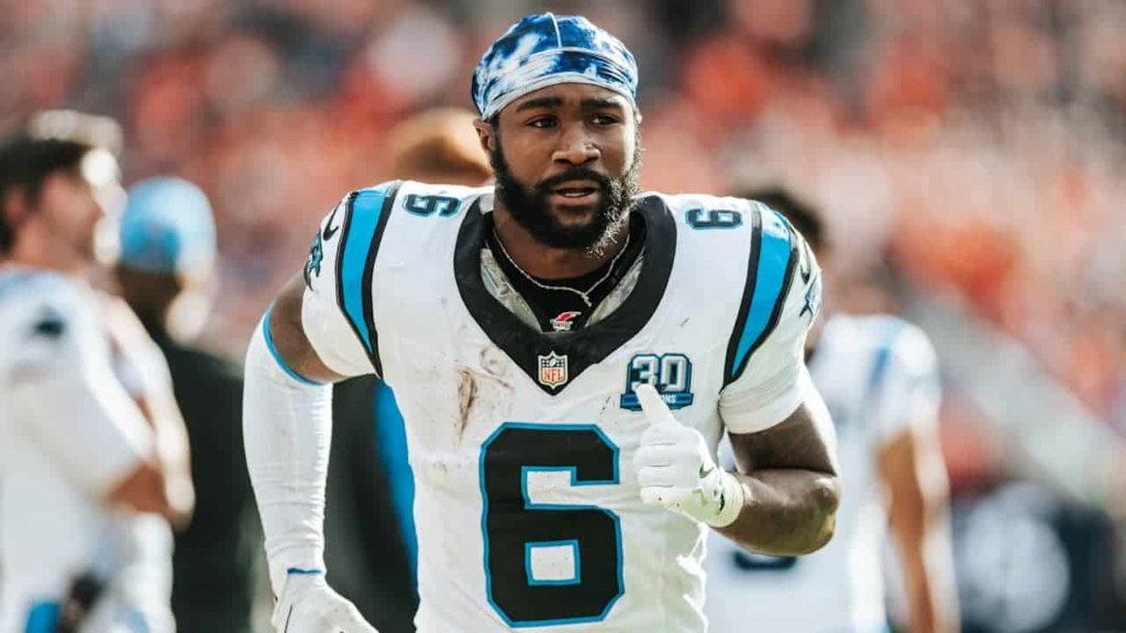 Derrick Brown during an NFL game, wearing his Carolina Panthers jersey, on the football field.