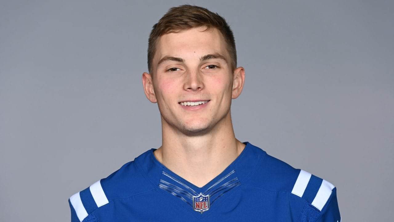 Young male football player in Dallas Cowboys jersey smiling for inside the star sports coverage.