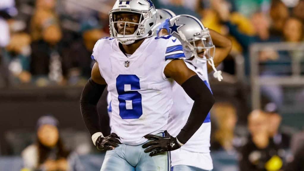 Vitality of a Dallas Cowboys football player during a game, wearing a helmet and jersey number 6, with a focused expression on the field.