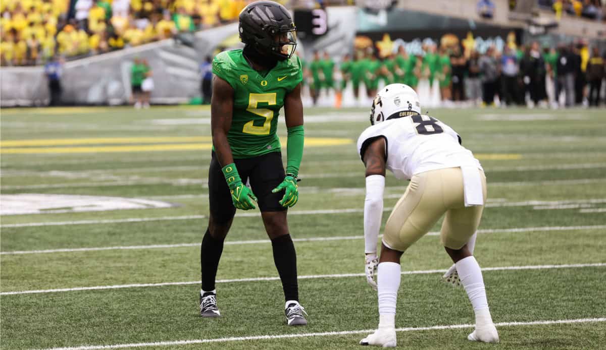 Behind the scenes of college football, players from Oregon Ducks and New Orleans Saints face off on the field during a game, showcasing athleticism and intense competition.