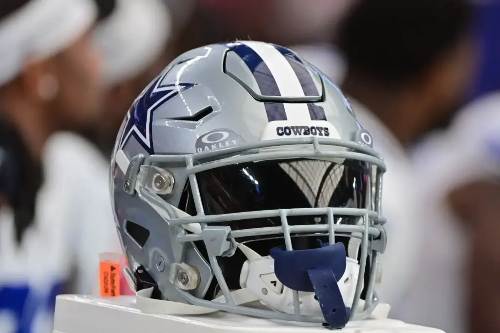 Dallas Cowboys football helmet on display, showcasing team branding and logo. Perfect for NFL fans, football memorabilia, and Dallas Cowboys merchandise, highlighting team spirit and sports equipment.