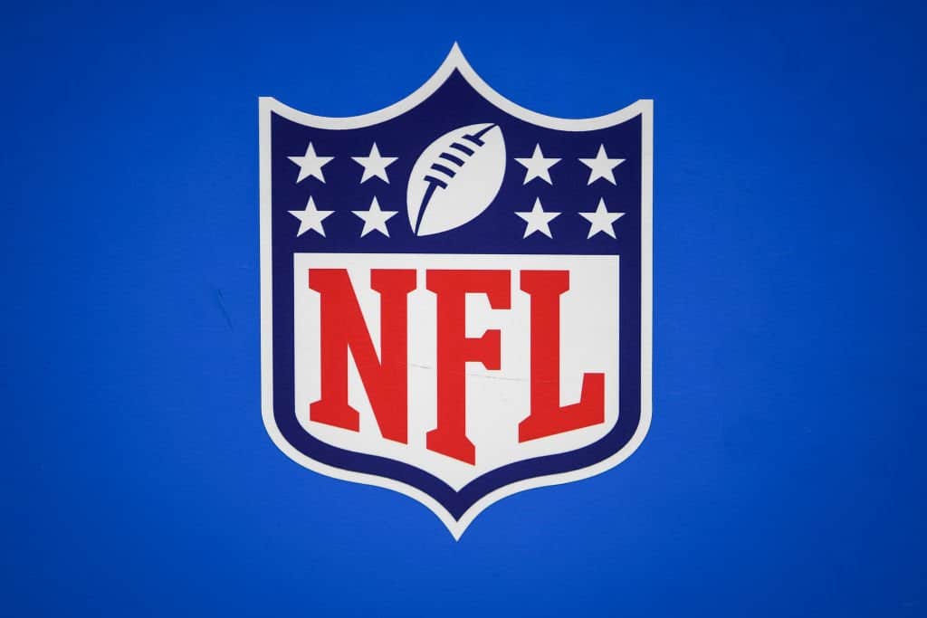 National Football League (NFL) logo on blue background, representing professional American football, Dallas Cowboys, Inside The Star sports coverage.