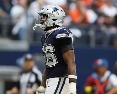 Dallas Cowboys football player in uniform during an NFL game.