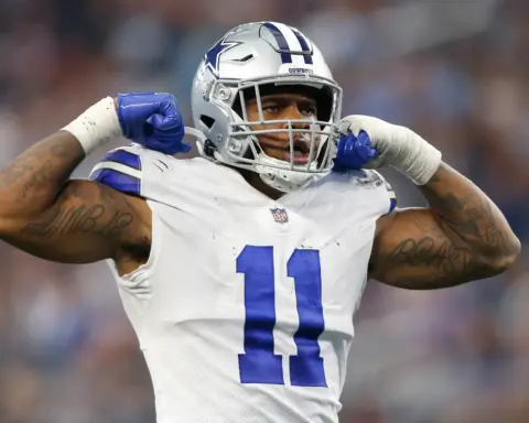 Dallas Cowboys football player celebrating on the field.