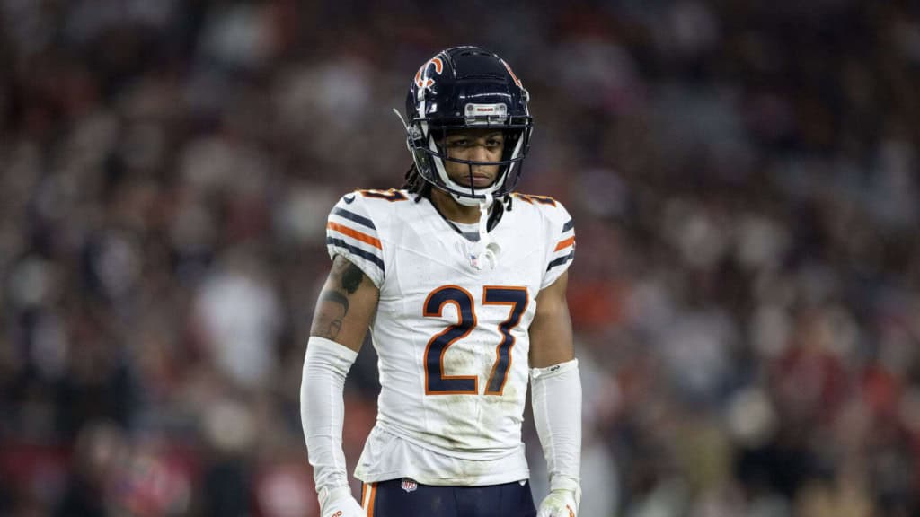 A Chicago Bears football player wearing jersey number 27 during a game, looking focused on the field with a blurred crowd in the background.