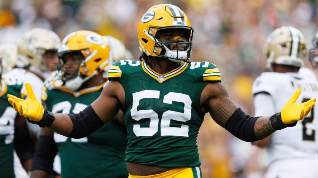 Green Bay Packers linebacker wearing #52 jersey on the field during an NFL game, with teammates in background.