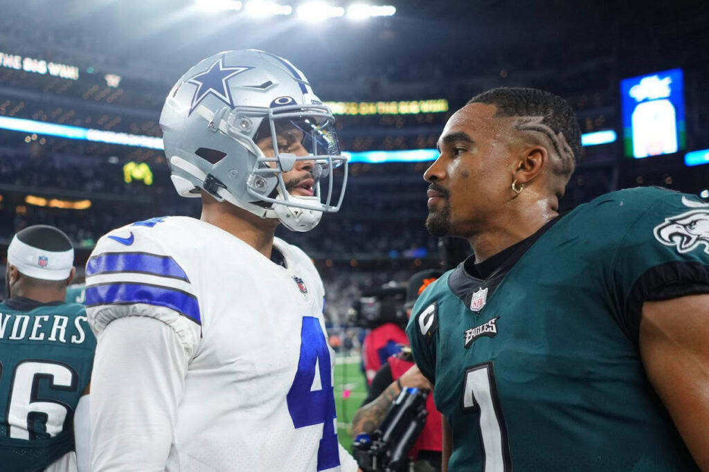Player conversations during an NFL game between the Dallas Cowboys and Philadelphia Eagles, highlighting team rivalry, game strategy, and athlete interaction. Focus on football players, helmets, uniforms, and stadium environment.