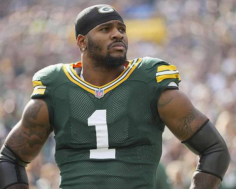 Lions, football player, NFL, Green Bay Packers, inside the star, sports, American football, player portrait, stadium background, game day, athlete in action.