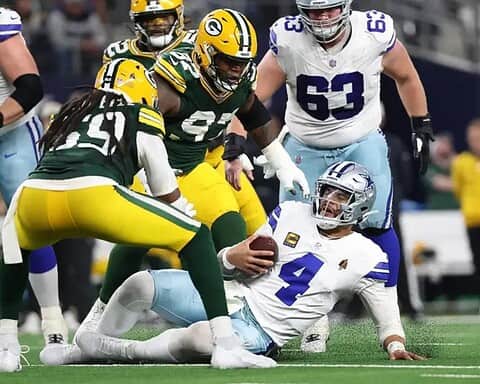 Green Bay Packers linebacker and Dallas Cowboys quarterback Dak Prescott during a football game.