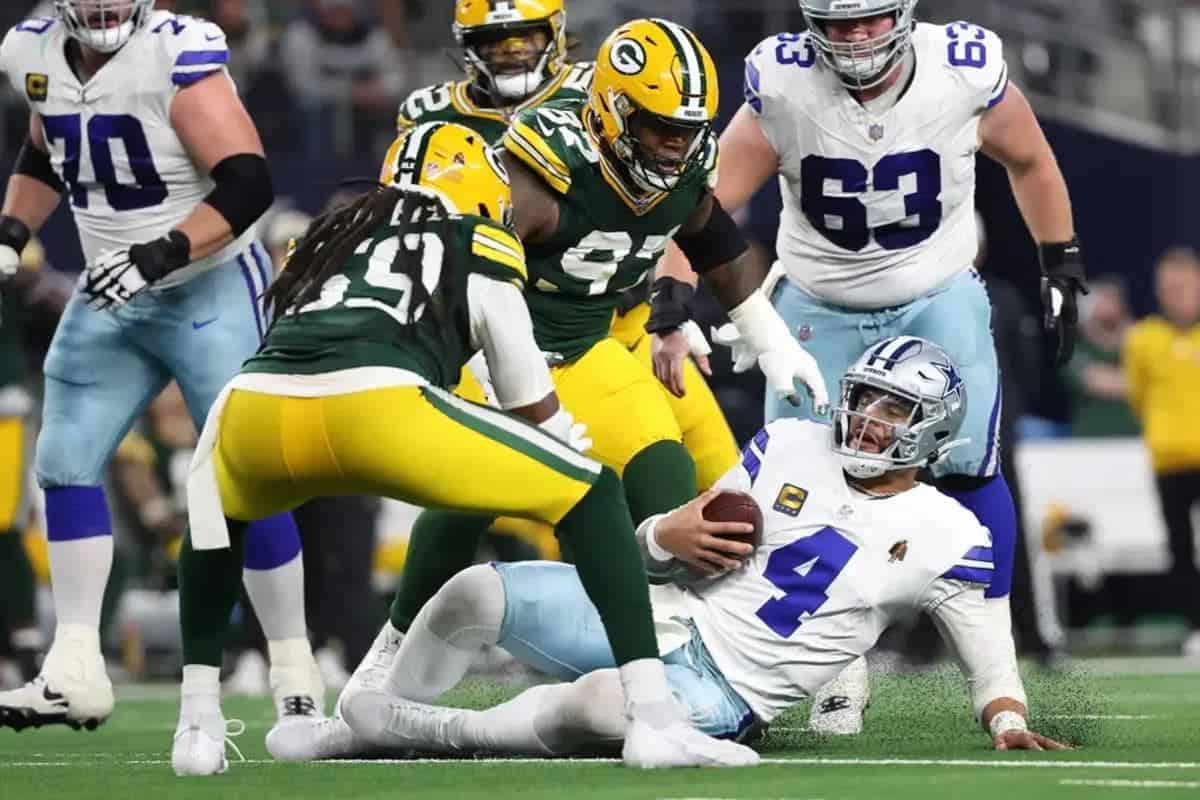 Green Bay Packers linebacker and Dallas Cowboys quarterback Dak Prescott during a football game.