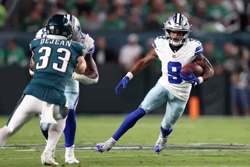 Dak Prescott carrying the football during a Dallas Cowboys game against the Jacksonville Jaguars. Focus on NFL football, Dallas Cowboys, and game action.