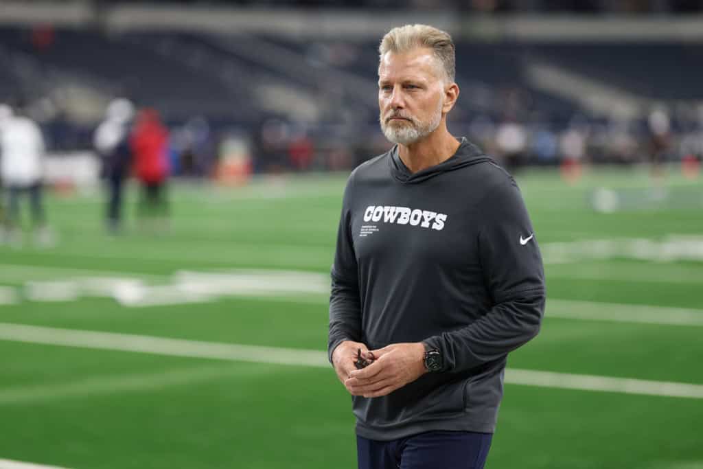 Matt Eberflus in Cowboys sweatshirt on field