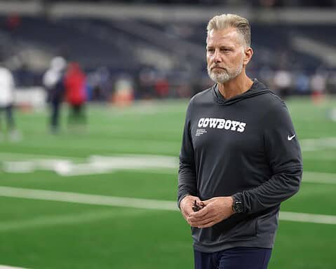 Matt Eberflus in Cowboys sweatshirt on field