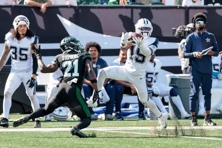 Inside The Star: Dallas Cowboys football players in action during a game, showcasing player skills and game intensity at AT&T Stadium, highlighting Dallas Cowboys' team performance.