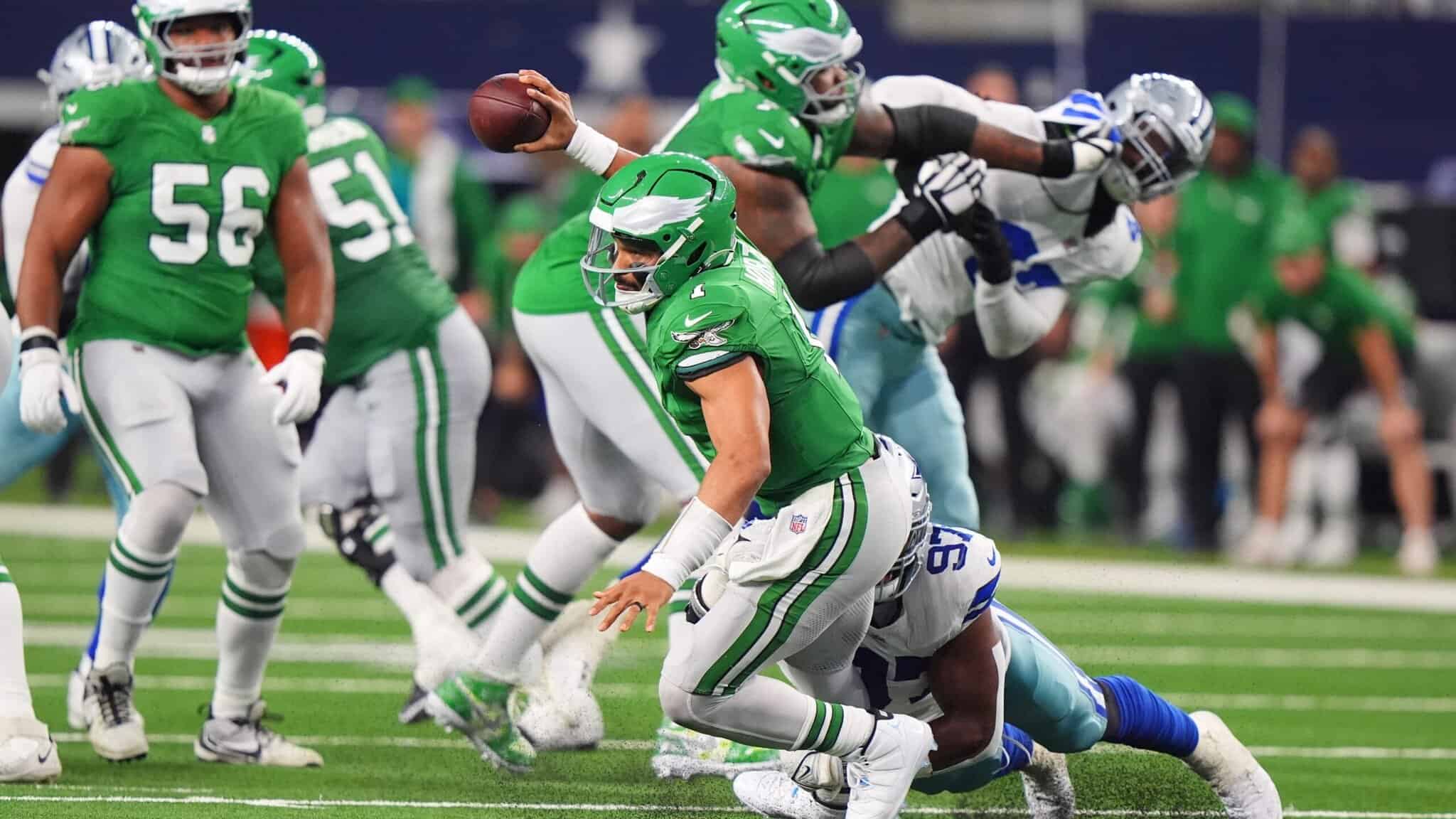 Eagles quarterback Jalen Hurts is sacked by Cowboys DT Osa Odighizuwa
