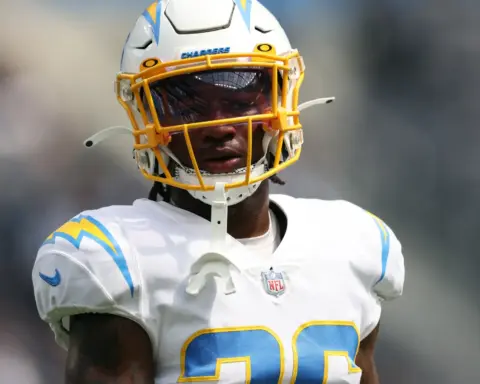 Rugby player wearing helmet and white jersey with blue and yellow accents, focused on the game, inside the star-themed sports blog.